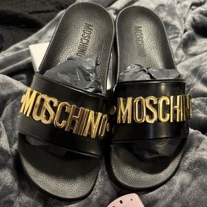 Moschino Black Slides with Gold Accents